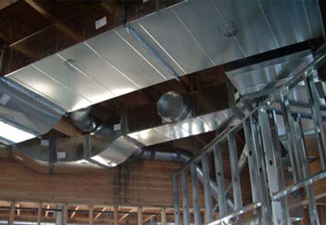 Exposed HVAC ductwork and metal framing in construction