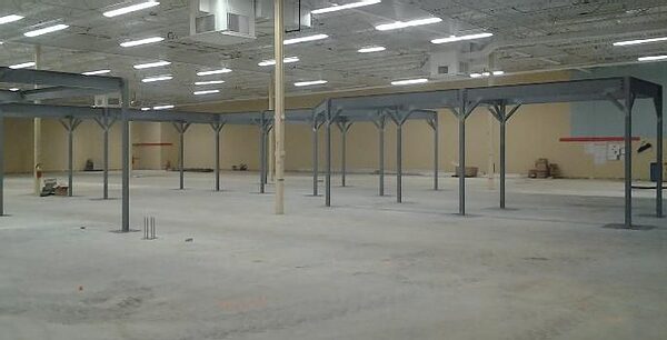 Empty industrial warehouse interior with steel columns